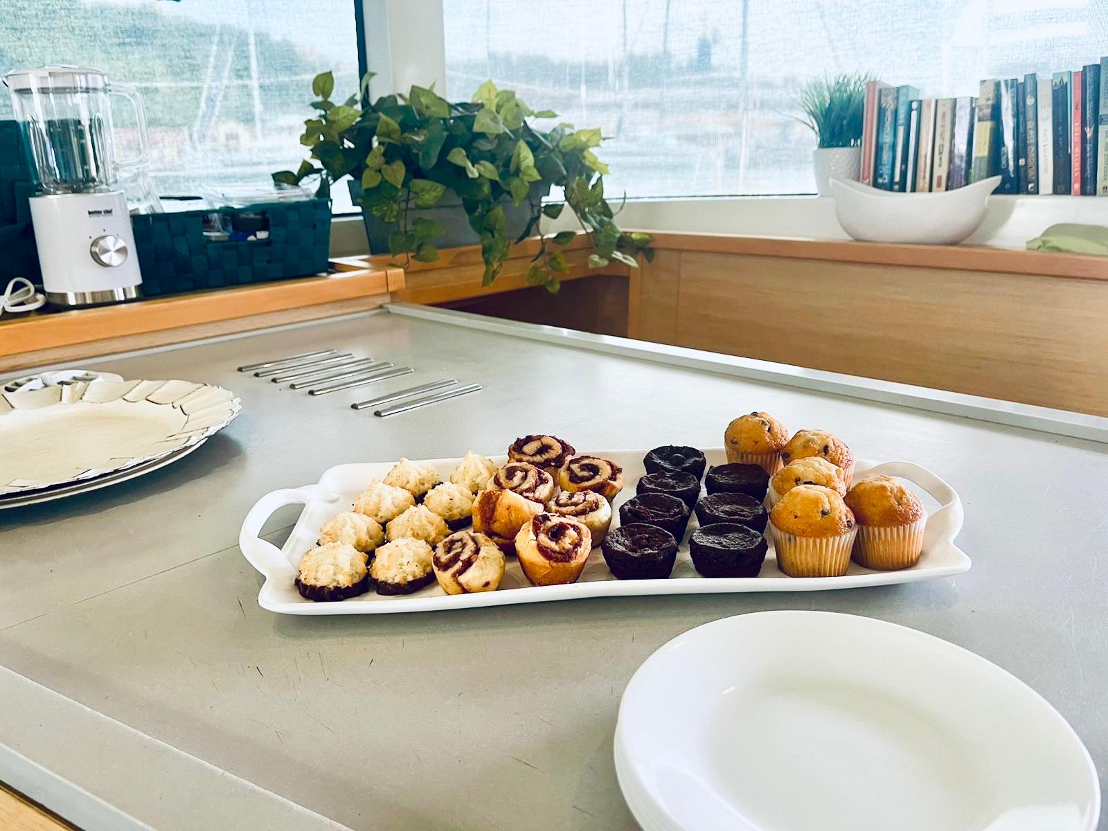 Fresh-baked muffins and pastries on galley counter